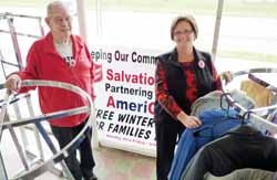 Bill Kelly, Salvation Army volunteer and Julie Brandt, AmeriGas employee are ready to accept winter clothing donations for families who need winter coats, snowpants, boots and mittens.