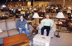 Rich Biller, left, and store manager Kory Walters in the showroom at Antigo’s new Lakeland Furniture & Mattress.