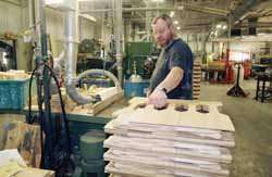 An employee at Zelazoski Wood Products at one of the company’s many woodworking stations.