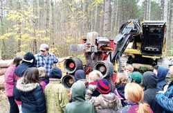 Antigo school district students learn about logging in the Crestwood School forest on Friday.