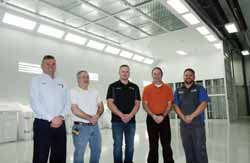 From left, Jerry Brickner of Brickners of Antigo with Paul Schroeder, head RV technician, Justin Edblom, body shop manager, Jeff Schuster, RV manager, and Luke Herman, assistant manager, in the Collision and RV Repair Center’s state-of-the-art paint booth.