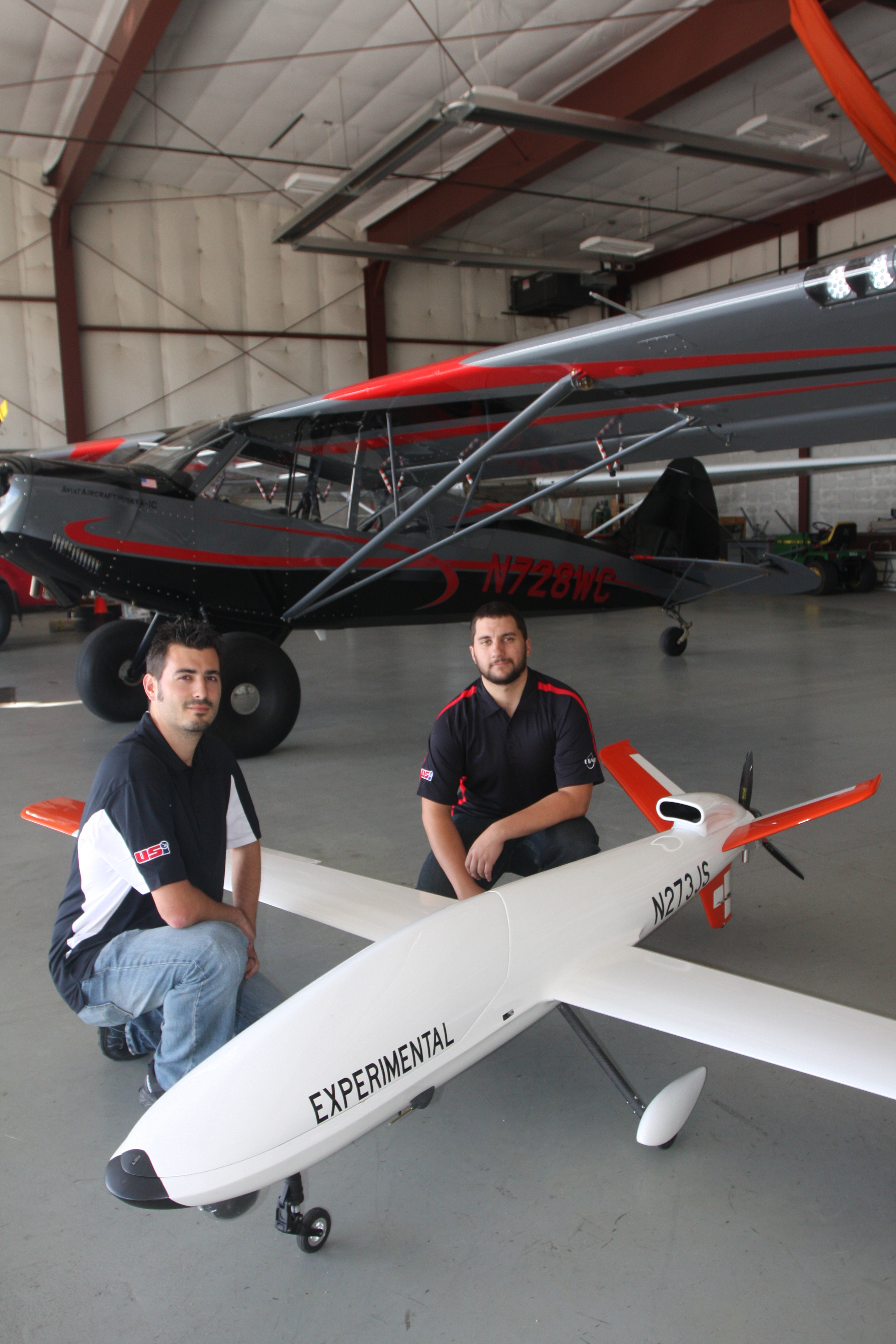 Alan Horzewski, left, and Cameron Berg posed with the Sandstorm unmanned aerial system, based at the Langlade County Airport. The two men are employed by Unmanned Systems, Inc., a ceter for research, development and training on the cutting-edge technology.