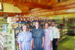 Mervin and Tanya Brubaker with daughters Luanne, at left, and Geneva in the Evergreen Shoppe, which will celebrate its grand opening beginning Friday.