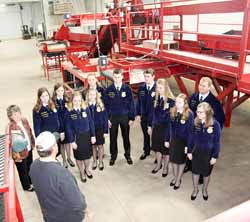Dan Kakes explains the intricacies of his potato grading equipment, purchased just last year, to state FFA officers.