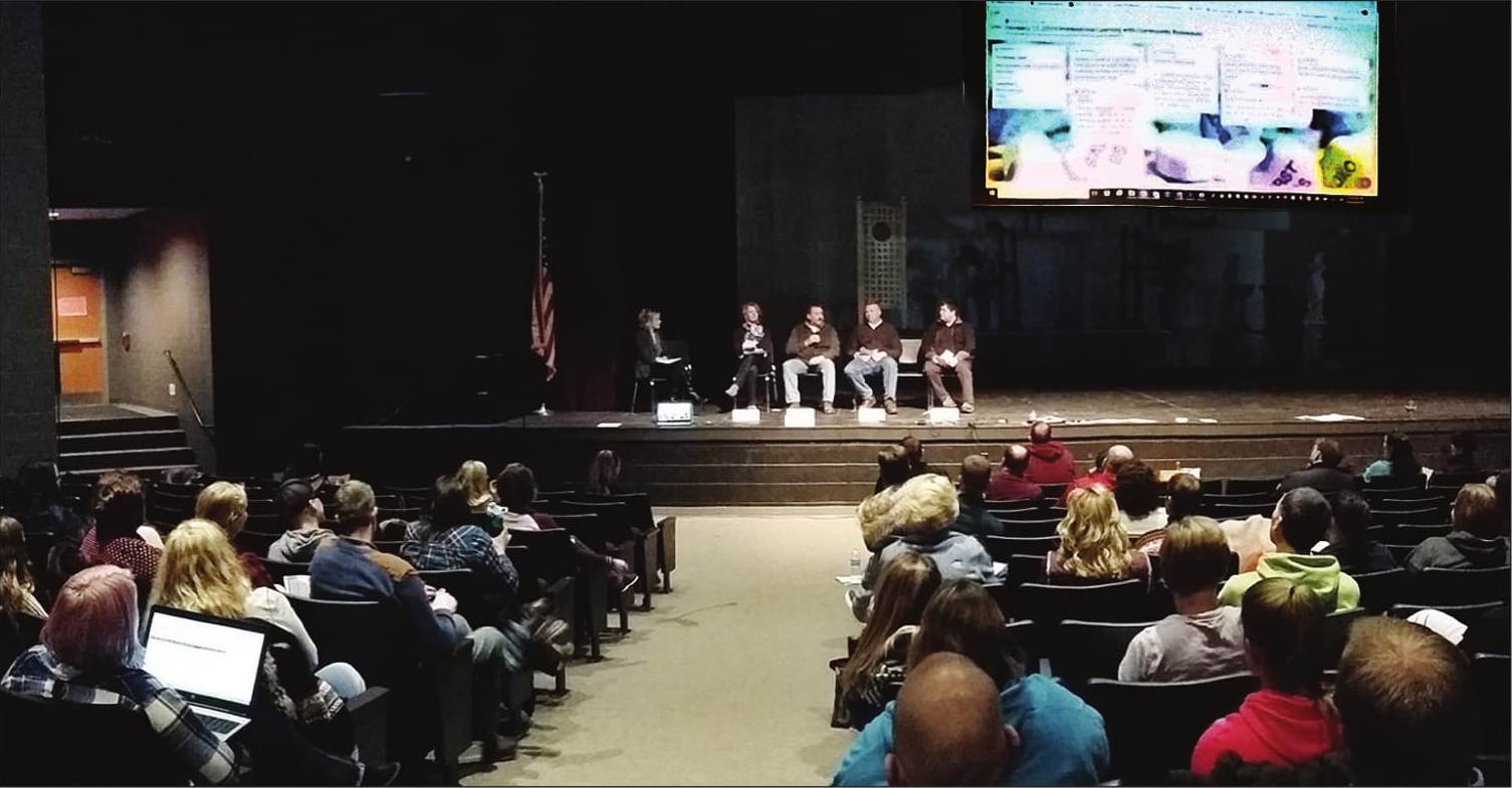 The business panel speaking with educators in the Volm Theater