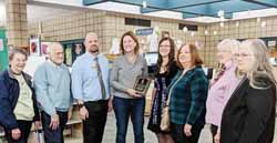 Rep. Mary Felzkowski, center, receives the legislator of the Year Award from members of the Antigo Public Library Board on behalf of the Wisconsin Valley Library Service.