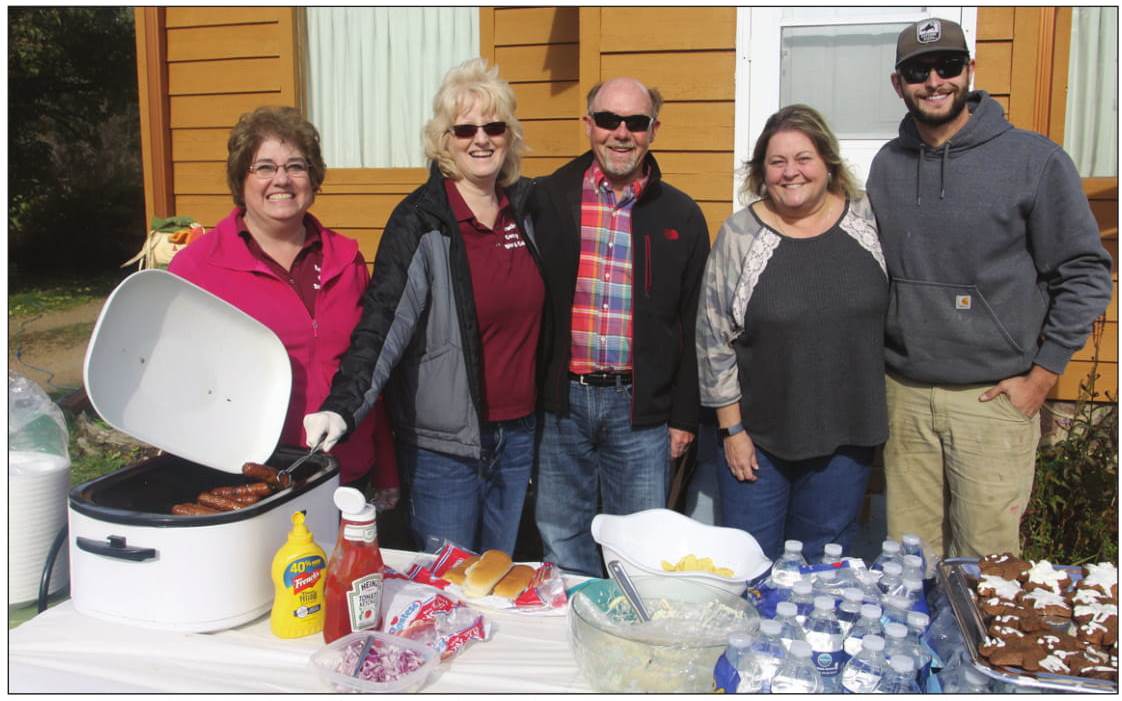 At a picnic celebrating the sale of Borucki’s County Store are Kristie Heistad
and Marlene Straley, who are selling, the real estate broker, Michael Bolen,
and the new owners Trina Trepanier and her son, Eric.