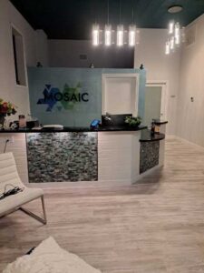 The reception desk in the lobby of Mosaic Massage and Float Center.
