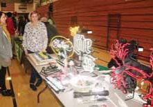 Angie Wickersheim, left, instructional coach and community outreach coordinator for the White Lake school district, discusses career opportunities at Antigo Zeon with Susie Kubacki.