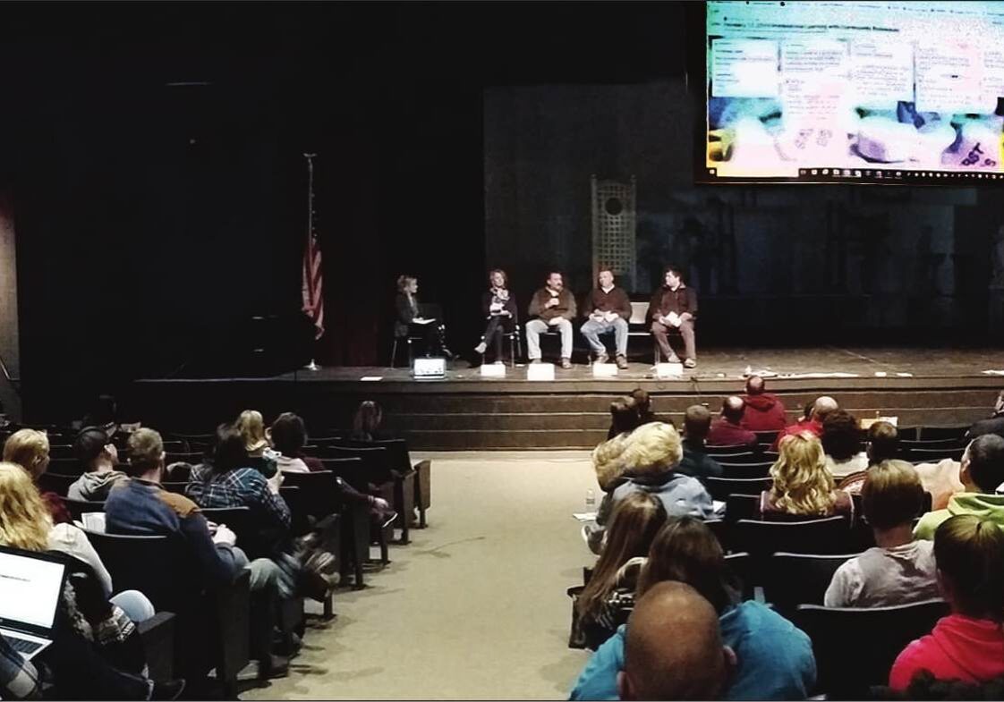 The business panel speaking with educators in the Volm Theater