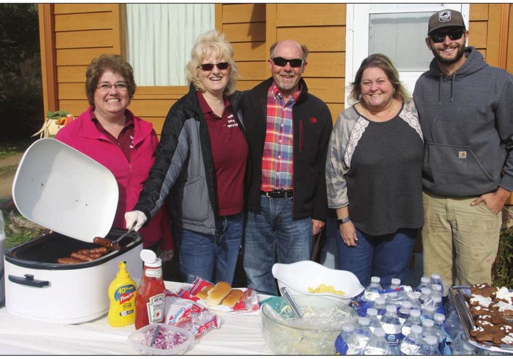 At a picnic celebrating the sale of Borucki’s County Store are Kristie Heistad
and Marlene Straley, who are selling, the real estate broker, Michael Bolen,
and the new owners Trina Trepanier and her son, Eric.