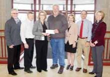 SUCCESS STORY - The resurgence in business in downtown and throughout Antigo is the top story of 2018 locally, and the entrepreneurship grants championed by the city, Langlade County and CoVantage Credit Union is a key component. This picture is from November, when CoVantage refilled the grant coffers with an additional $25,000 donation. From left are City Administrator Mark Desotell, Dan Hansen and Sherry Aulik, representing the credit union, Mayor Bill Brandt, Langlade County Finance Director Pam Resch, Corporation Counsel Robin Stowe and Angie Close, director of the Langlade County Economic Development Corporation.