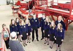 Dan Kakes explains the intricacies of his potato grading equipment, purchased just last year, to state FFA officers.