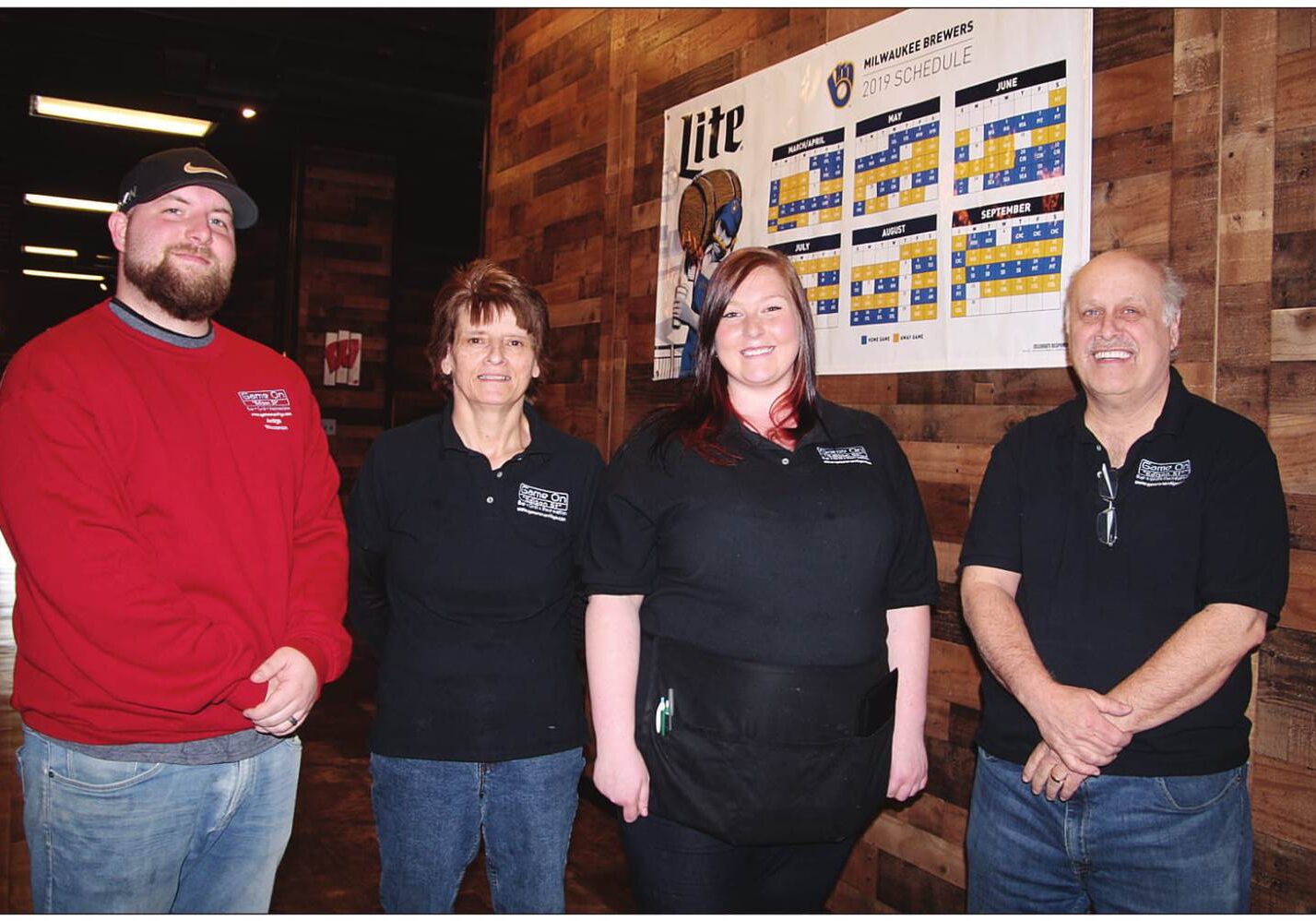 From left, Kane Goerke, Jolene Zarda, Hannan Lindemann and owner Randy Reese are ready for today’s
Milwaukee Brewer opener at Game One, Antigo’s newest sports bar. There’s not a bad seat in the house.