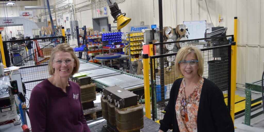 Angie Close, LCEDC Executive Director, and Julie Berndt, Johnson Electric Coil owner discuss funding options for the purchase of Johnson Electric Coil.