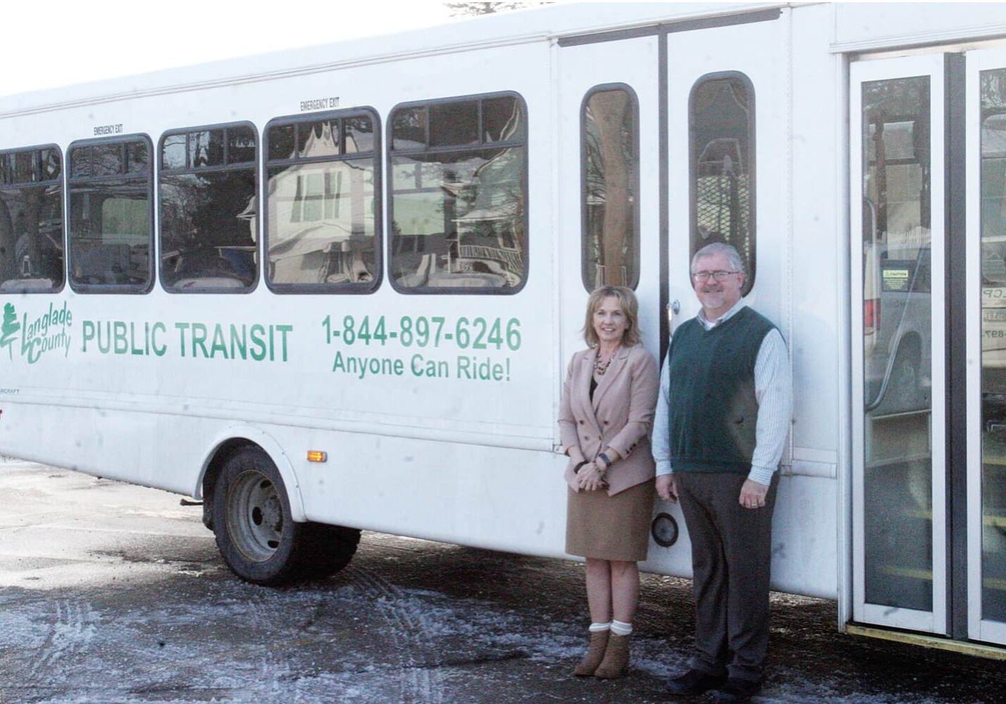 Pam Resch, Langlade County Finance Director, and Danny Pyeatt, Antigo supervisor for Red Robin/Menominee
Department of Transit Services, show off the fresh look for the rebranded county-wide transit system.