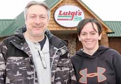 Dominic Badalamenti, owner of Luigi's, and local manager Fawn Kennedy outside the new Antigo location, the former Refuge Restaurant.