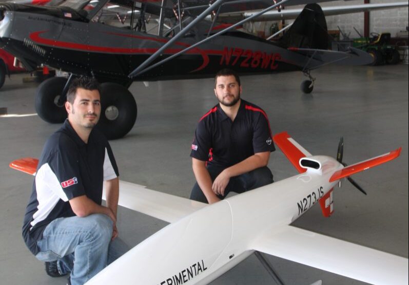 Alan Horzewski, left, and Cameron Berg posed with the Sandstorm unmanned aerial system, based at the Langlade County Airport.  The two men are employed by Unmanned Systems, Inc., a ceter for research, development and training on the cutting-edge technology.