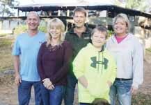 From the left, Andy Buettner, Jamee Peters, Brent, Kohlten and Jackie Hipke Tuesday afternoon in front of the former Wild Wolf Inn, now Crab and Jack's. 